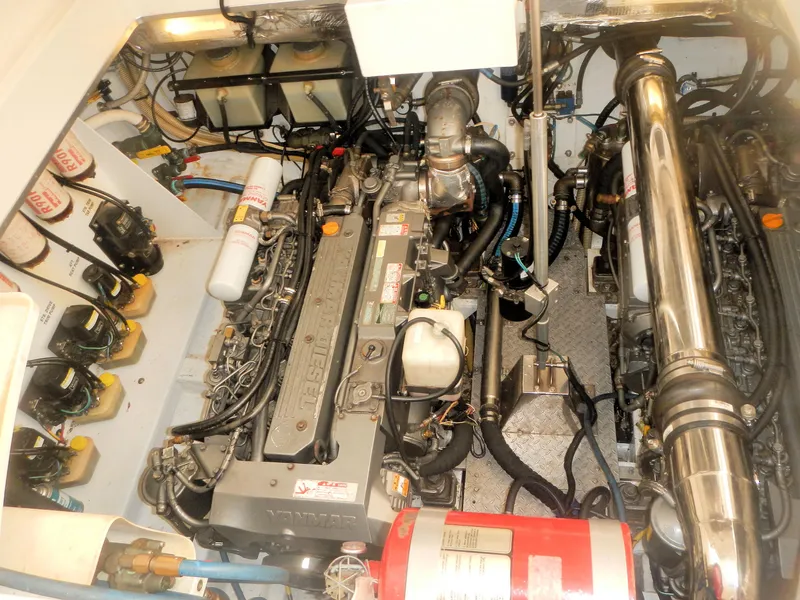 Slide: The Image of Engine room of 2006 Fountain 48 Express Cruiser, showcasing detailed mechanical components. - 6