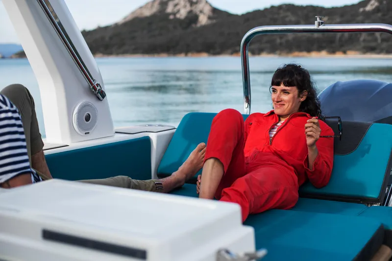 Slide: The Image of Woman relaxing on a 2025 Zodiac Medline 7.5 boat, enjoying a scenic view. - 12