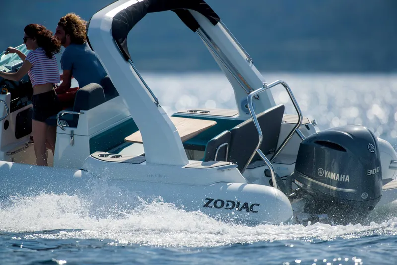 Slide: The Image of 2025 Zodiac Medline 7.5 boat cruising with Yamaha engine on a sunny day. - 8