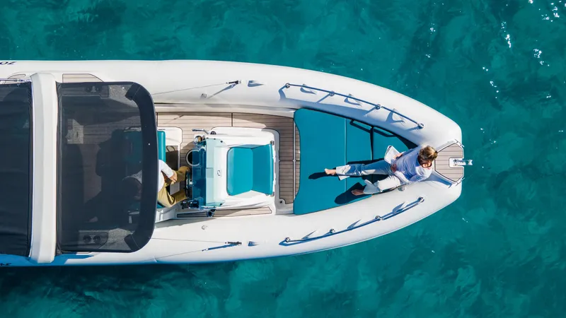 Slide: The Image of 2025 Zodiac Medline 7.5 boat on clear blue water, top view. - 13