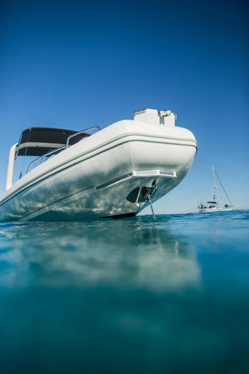 Slide: The Image of 2025 Zodiac Medline 7.5 boat on clear blue water, under a sunny sky. - 20