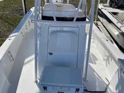 Slide: The Image of 2018 BlackJack 256 Bay boat interior with center console and seating. - 10