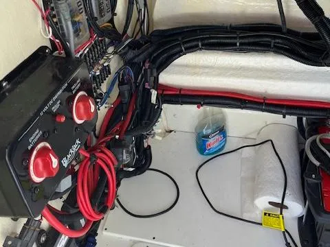 Slide: The Image of 2018 BlackJack 256 Bay boat electrical system with wiring and switches. - 11