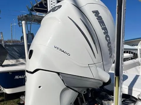 Slide: The Image of 2018 BlackJack 256 Bay boat with Mercury Verado engine, docked outdoors. - 3
