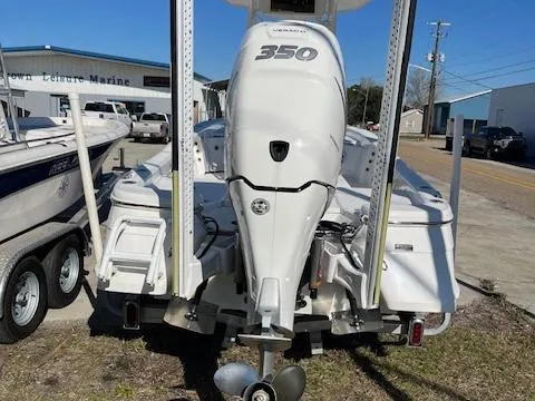Slide: The Image of 2018 BlackJack 256 Bay boat with a 350 horsepower engine, parked on a trailer. - 4