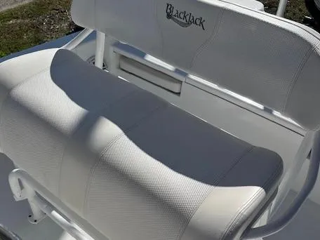 Slide: The Image of White seating on 2018 BlackJack 256 Bay boat, featuring logo embroidery. - 6