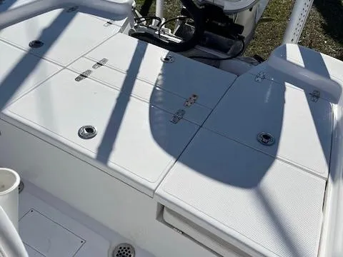 Slide: The Image of 2018 BlackJack 256 Bay boat deck with storage compartments and seating. - 7