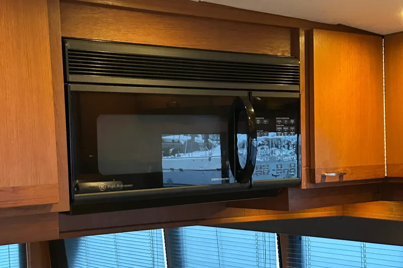 Slide: The Image of Built-in microwave in 1990 Tollycraft 57 wide body yacht kitchen. - 23