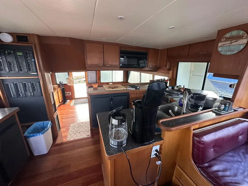 Slide: The Image of Interior of 1990 Tollycraft 57 wide body yacht with modern kitchen amenities. - 6