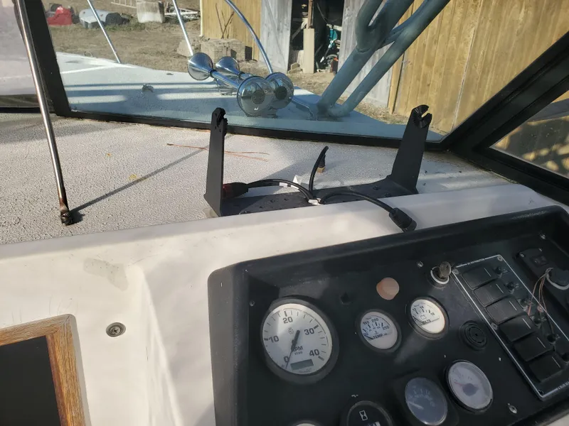 Slide: The Image of 1986 Sport-Craft Sportfisher dashboard with gauges and controls. - 10