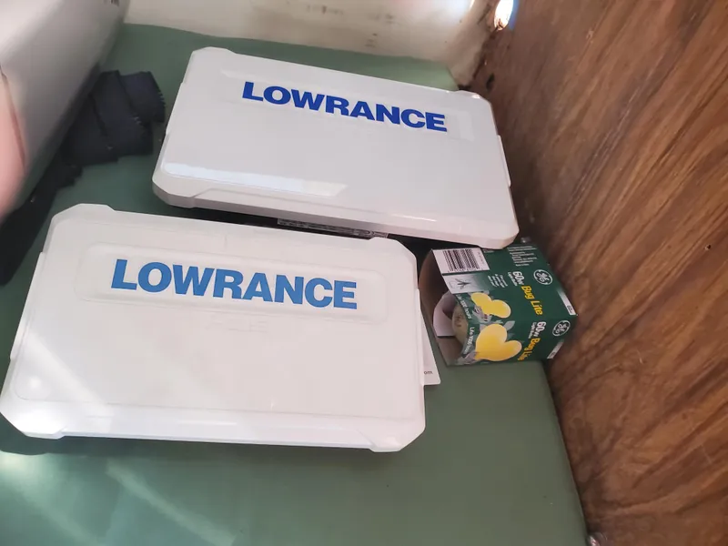 Slide: The Image of Lowrance equipment boxes on a 1986 Sport-Craft Sportfisher boat interior. - 11