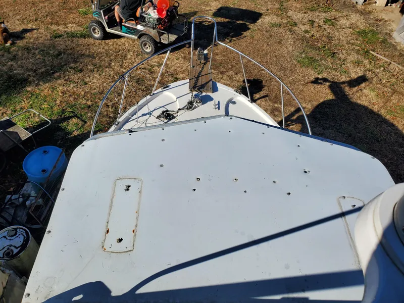 Slide: The Image of 1986 Sport-Craft Sportfisher boat on land, viewed from above, with surrounding equipment. - 27