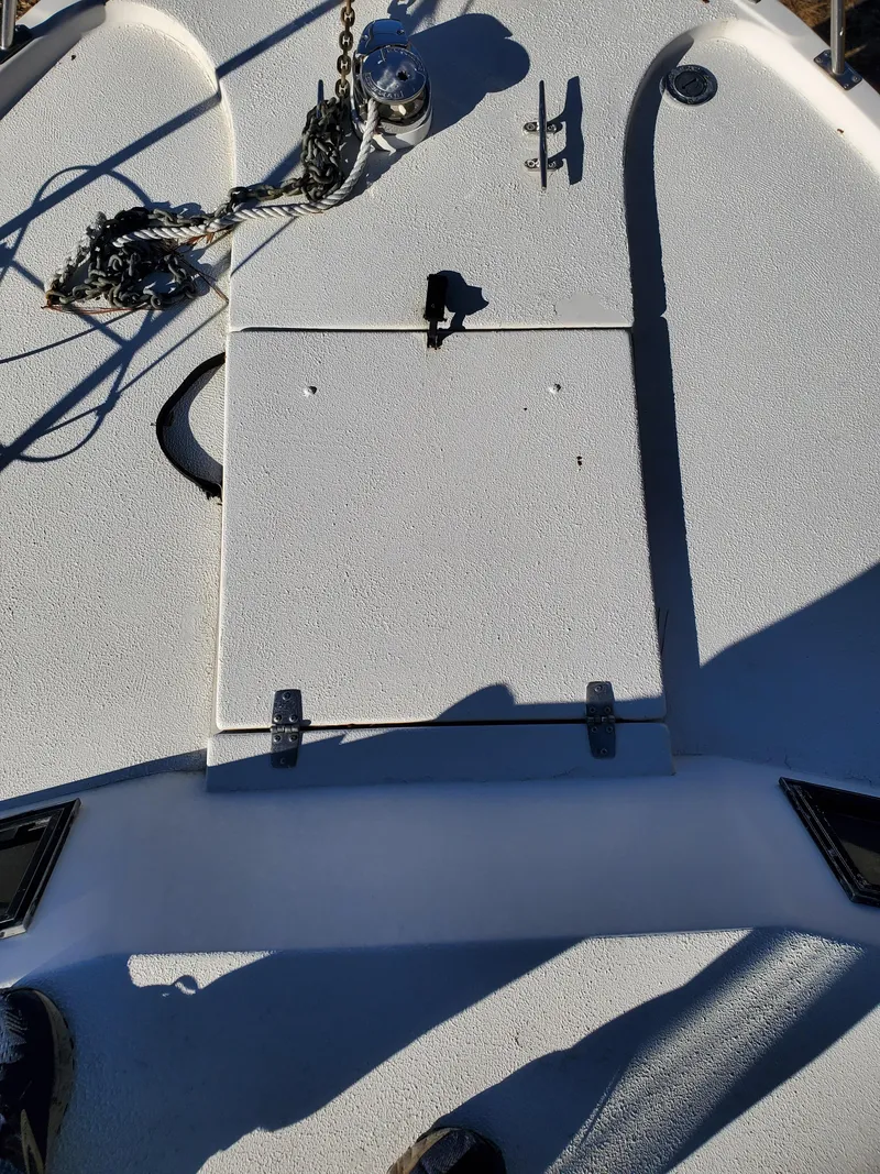 Slide: The Image of 1986 Sport-Craft Sportfisher boat deck with anchor and hatch. - 30