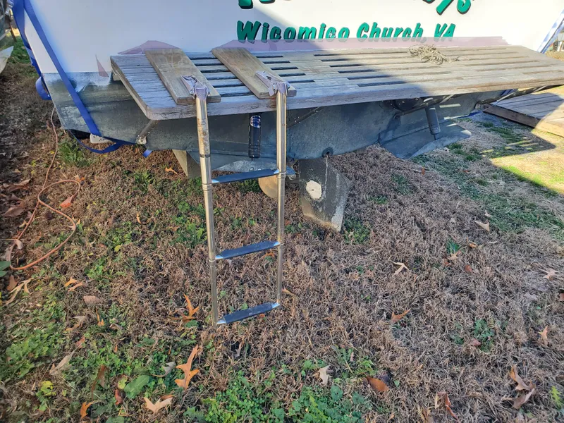 Slide: The Image of 1986 Sport-Craft Sportfisher boat with ladder on grassy ground. - 36