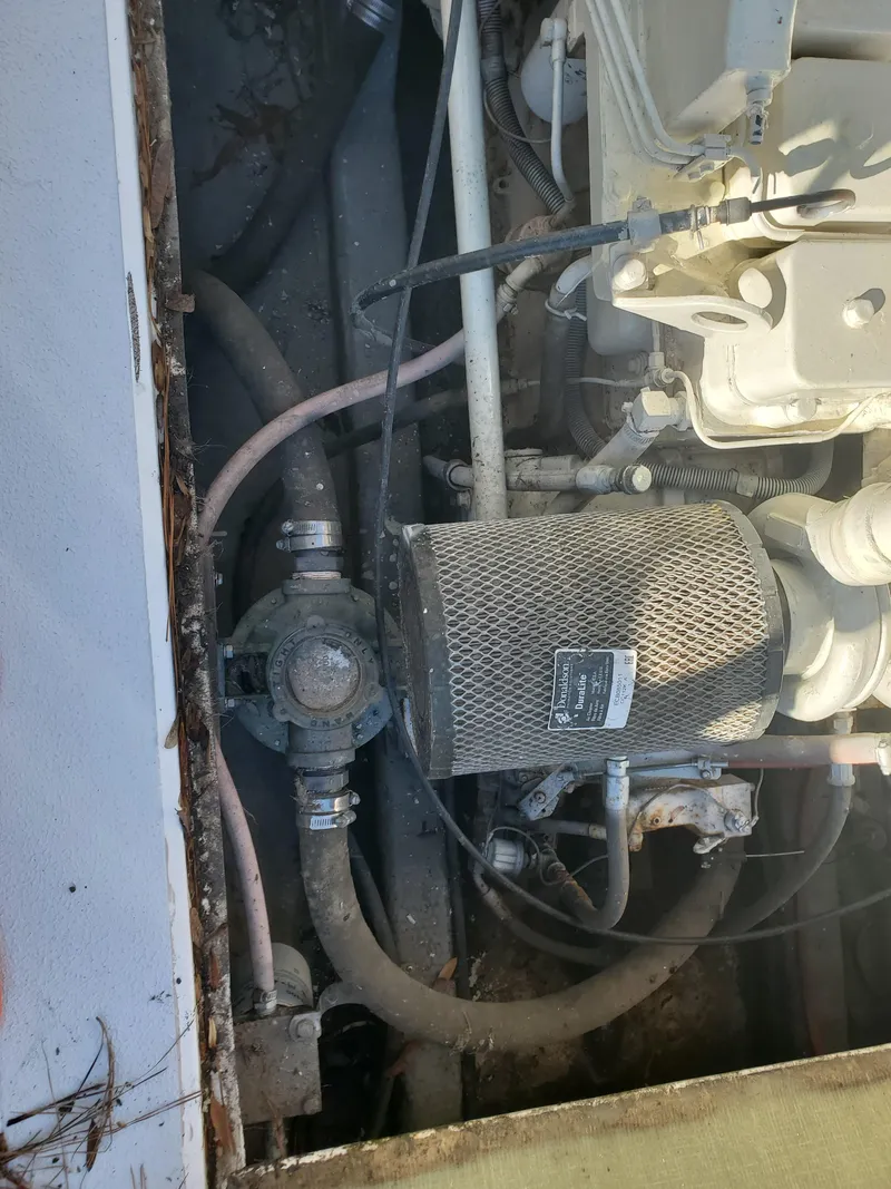 Slide: The Image of 1986 Sport-Craft Sportfisher engine compartment with visible hoses and components. - 6