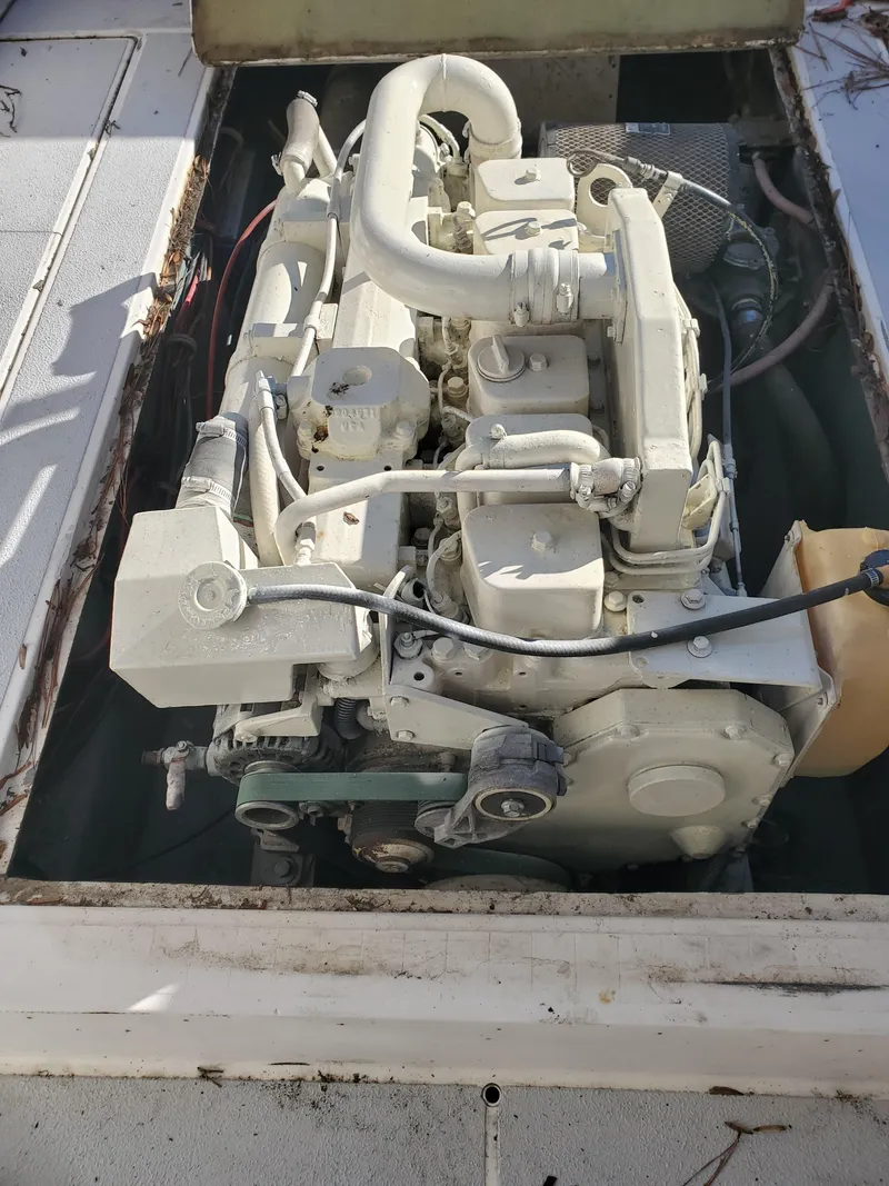 Slide: The Image of 1986 Sport-Craft Sportfisher engine compartment with visible marine engine components. - 7