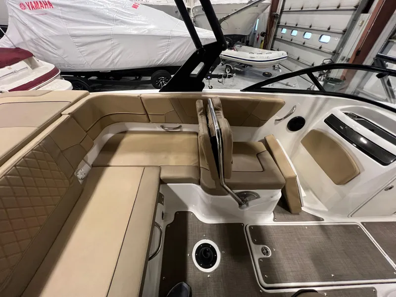 Slide: The Image of 2022 Bayliner VR5 Bowrider I/O interior with beige seating and modern design. - 22
