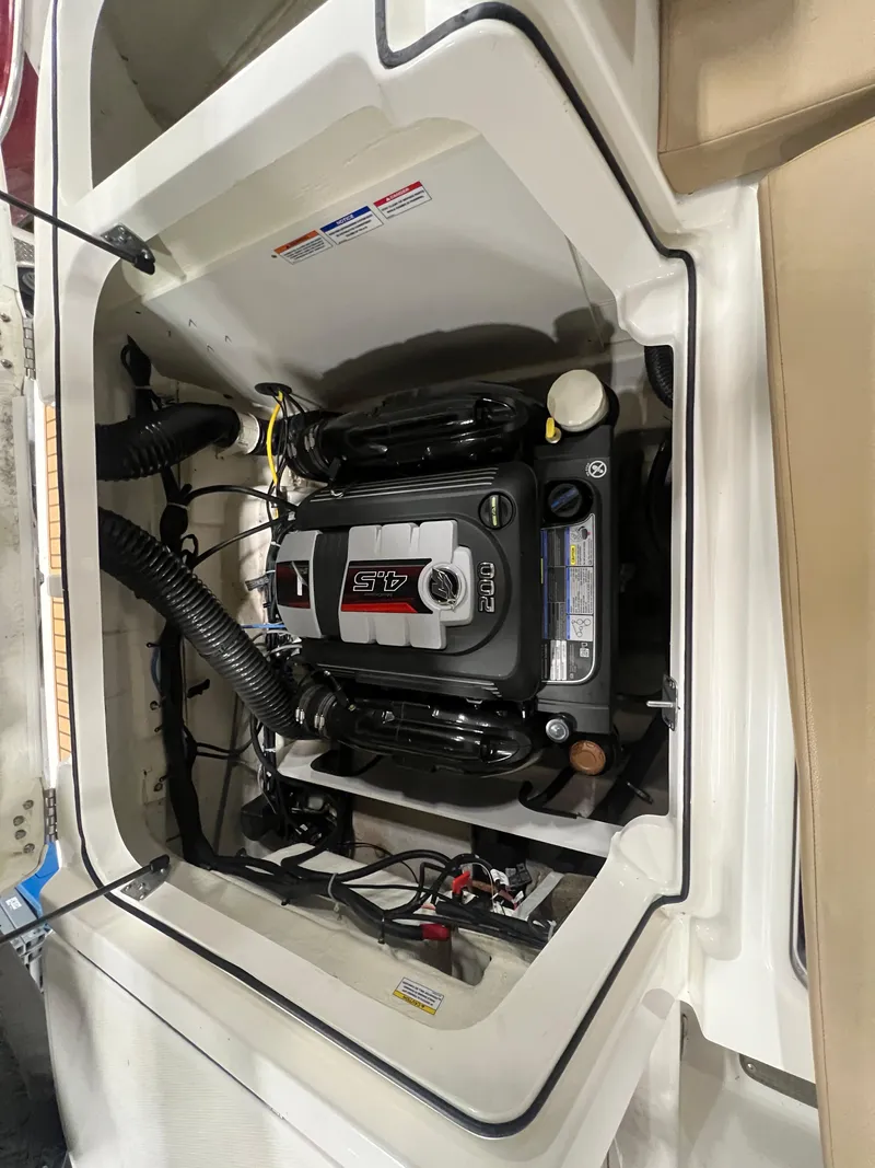 Slide: The Image of 2022 Bayliner VR5 Bowrider I/O engine compartment with detailed view of the engine. - 24