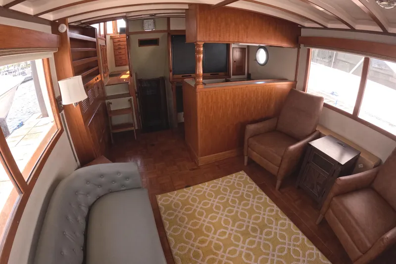 Slide: The Image of Luxurious 1988 Kadey-Krogen 42 yacht interior with elegant wood finishes and comfortable seating. - 10