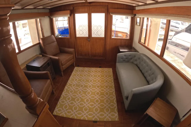 Slide: The Image of Interior of 1988 Kadey-Krogen 42 yacht with cozy seating and wooden decor. - 11