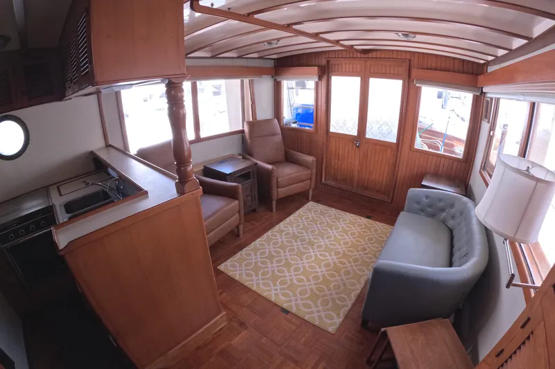 Slide: The Image of Interior of 1988 Kadey-Krogen 42 yacht with cozy seating and wooden finishes. - 12