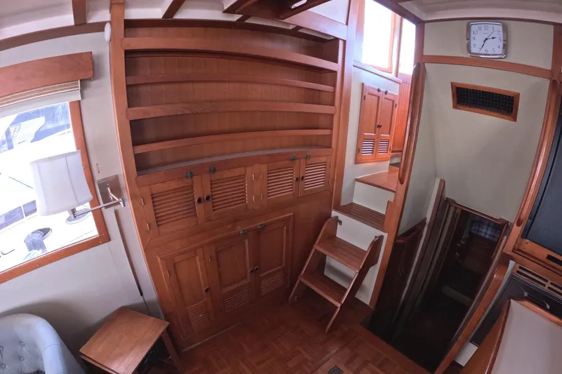 Slide: The Image of Interior of 1988 Kadey-Krogen 42 yacht with wooden cabinetry and stairs. - 13