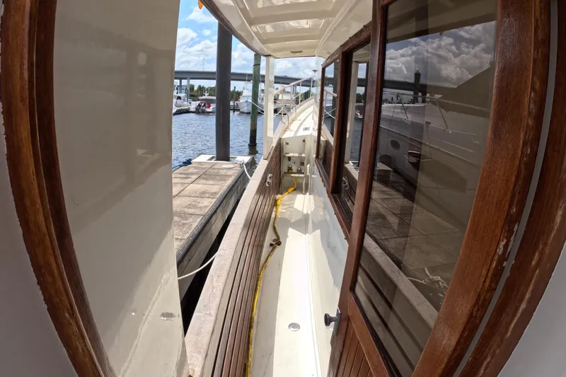 Slide: The Image of Side deck view of 1988 Kadey-Krogen 42 yacht docked at marina. - 41