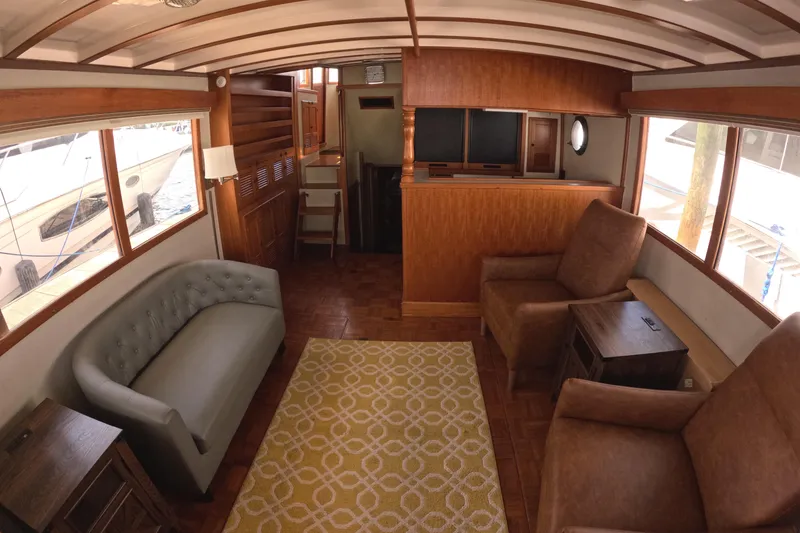 Slide: The Image of Interior of 1988 Kadey-Krogen 42 yacht with cozy seating and wooden accents. - 8