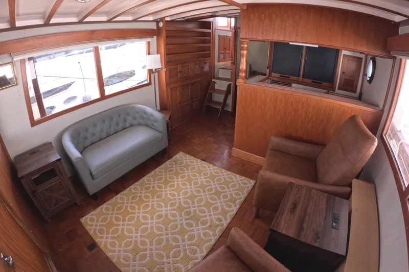 Slide: The Image of Interior of 1988 Kadey-Krogen 42 yacht with cozy seating and wooden accents. - 9
