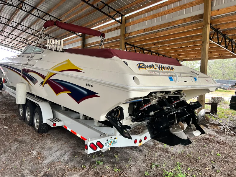 Slide: The Image of 1997 Fountain 47' Lightning speedboat on trailer in covered storage. - 10
