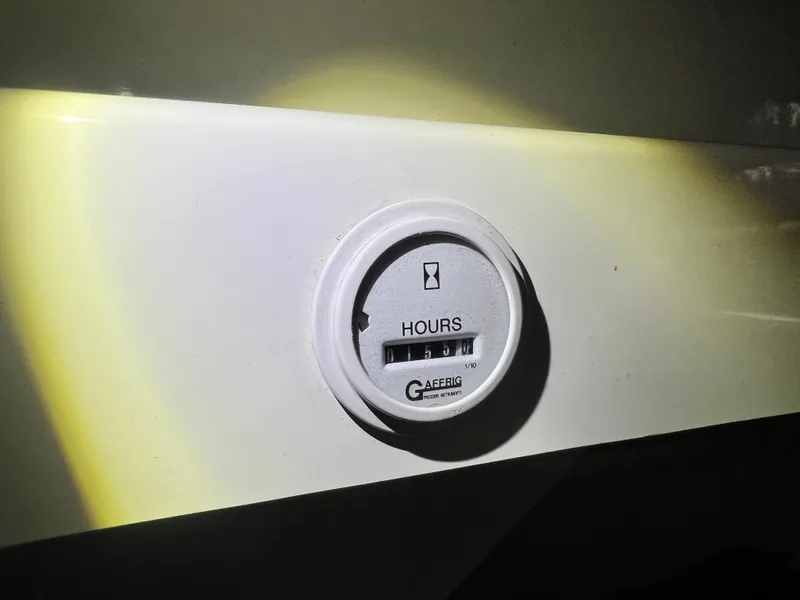 Slide: The Image of Hour meter on 1997 Fountain 47' Lightning boat dashboard. - 21