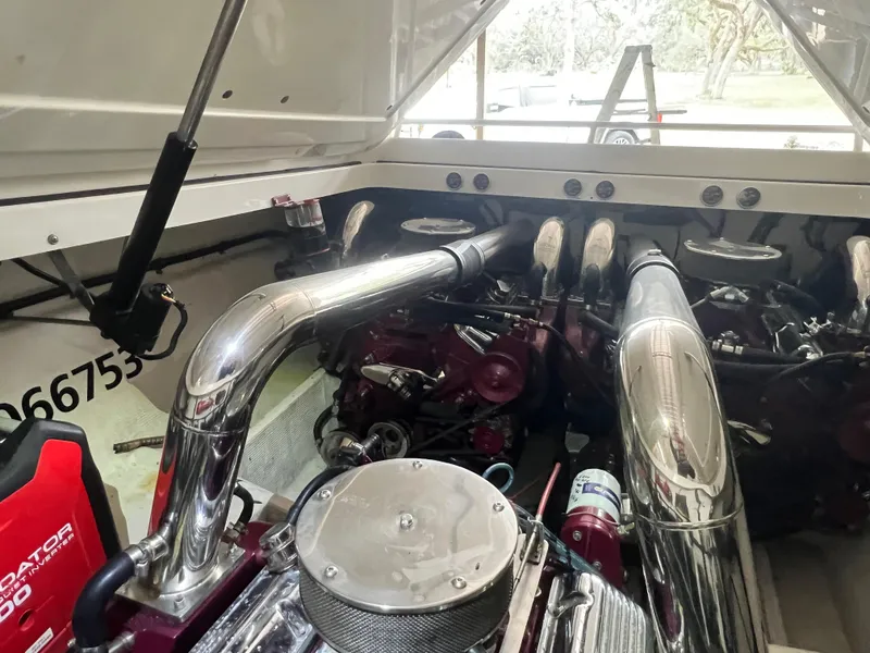 Slide: The Image of Engine compartment of a 1997 Fountain 47' Lightning boat with polished components. - 25