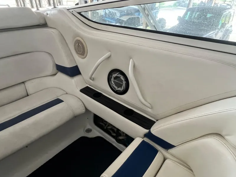 Slide: The Image of Interior of 1997 Fountain 47' Lightning boat with white and blue seating. - 32