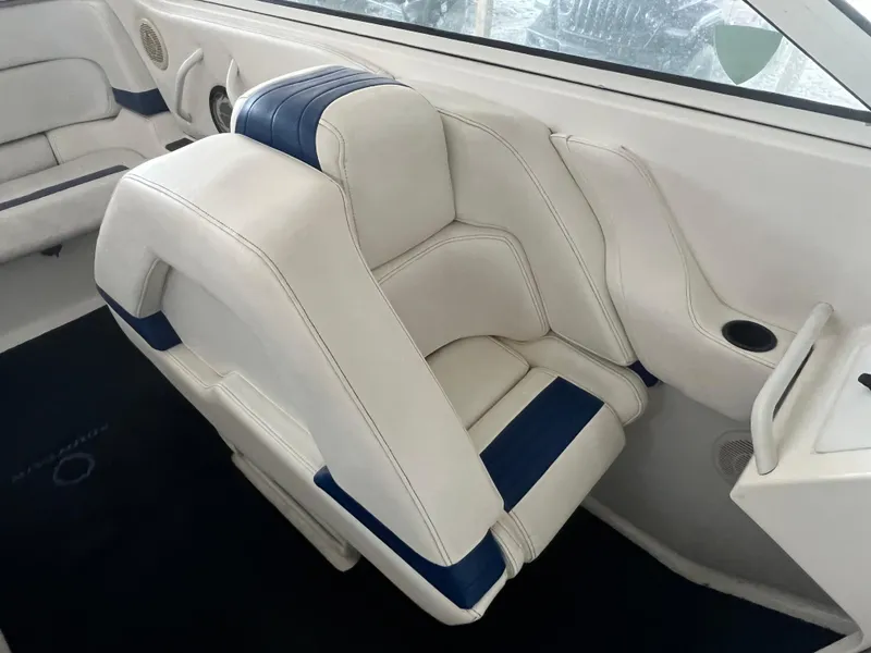 Slide: The Image of 1997 Fountain 47' Lightning boat interior with white and blue seating. - 33