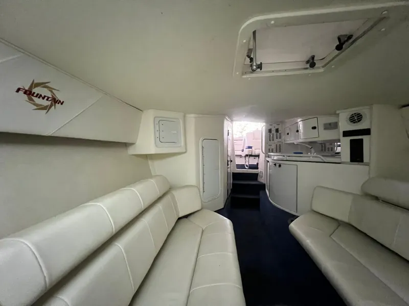 Slide: The Image of Interior of 1997 Fountain 47' Lightning boat with white seating and modern amenities. - 42