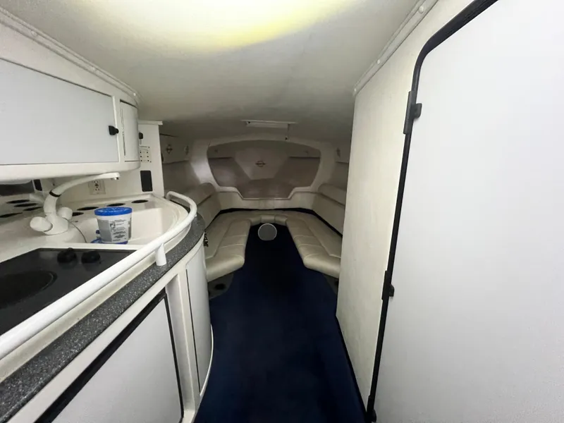 Slide: The Image of Interior of 1997 Fountain 47' Lightning boat with seating and kitchenette. - 46
