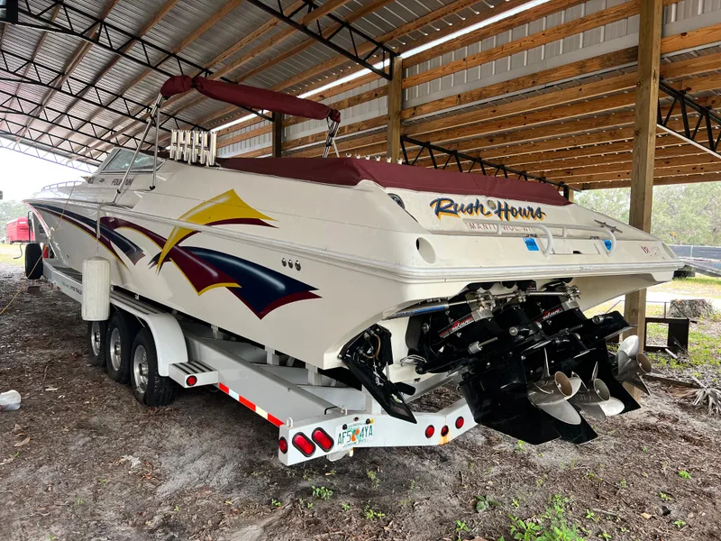 Slide: The Image of 1997 Fountain 47' Lightning speedboat on trailer under shelter. - 7