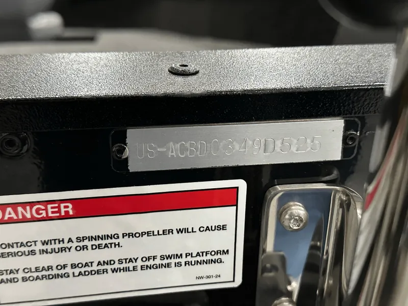 Slide: The Image of 2025 Alumacraft Competitor 185X Tiller serial number and safety warning label. - 26