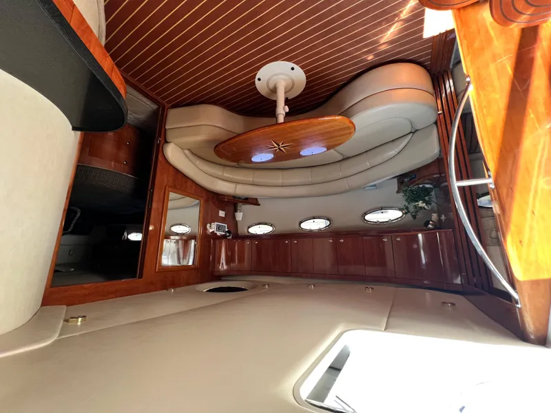 Slide: The Image of Luxurious interior of 2002 Regal Commodore 4260 yacht with elegant wood finishes. - 12