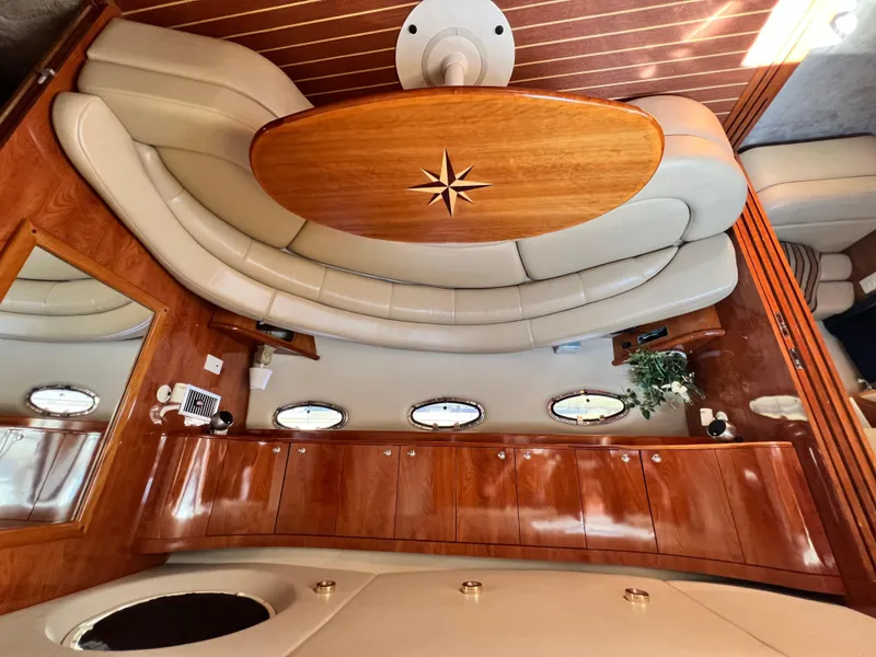Slide: The Image of Luxurious interior of 2002 Regal Commodore 4260 yacht with elegant wood and leather finishes. - 13