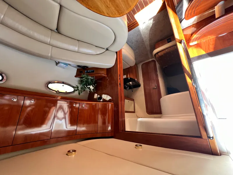Slide: The Image of Luxurious interior of 2002 Regal Commodore 4260 yacht with elegant wood finishes. - 14