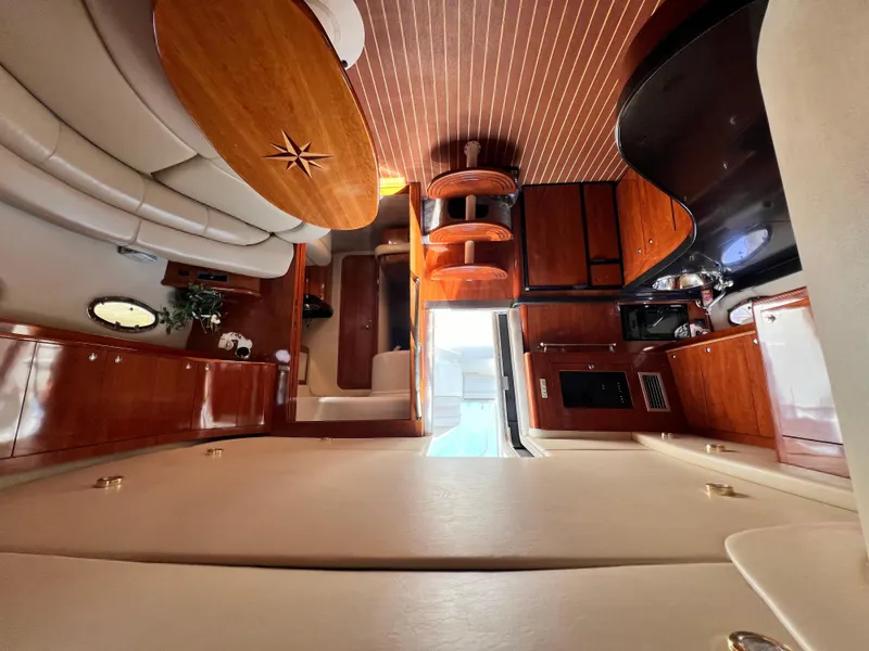 Slide: The Image of Luxurious interior of 2002 Regal Commodore 4260 yacht with wood finishes and modern amenities. - 17