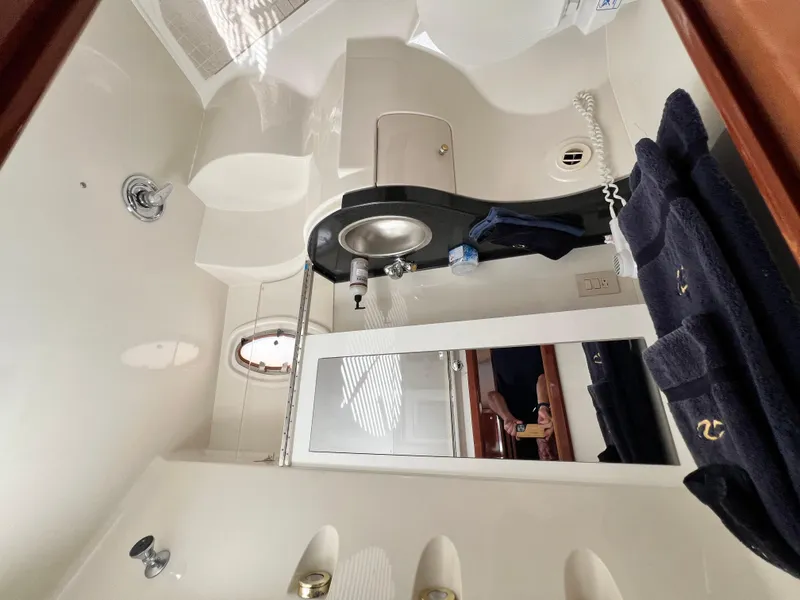 Slide: The Image of Luxurious bathroom interior of 2002 Regal Commodore 4260 yacht with modern fixtures. - 18