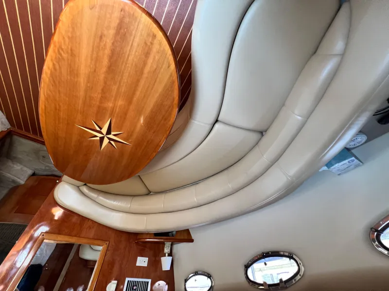 Slide: The Image of Luxurious interior of 2002 Regal Commodore 4260 yacht with elegant wood and leather seating. - 23