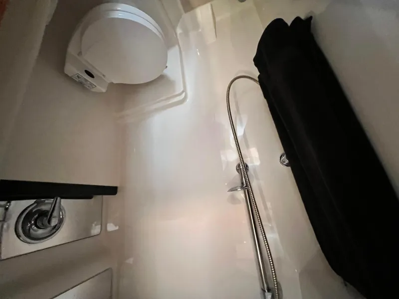 Slide: The Image of Interior of 2002 Regal Commodore 4260 yacht bathroom with shower and toilet. - 30