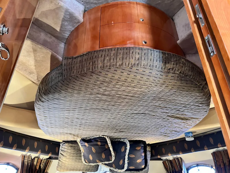 Slide: The Image of Interior cabin of 2002 Regal Commodore 4260 yacht with cozy bedding and wooden accents. - 37