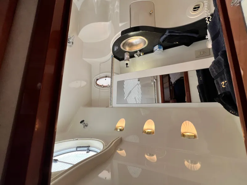 Slide: The Image of Luxurious bathroom interior of 2002 Regal Commodore 4260 yacht, featuring modern fixtures and lighting. - 42