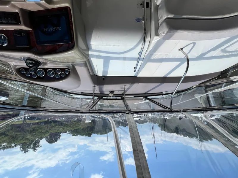 Slide: The Image of Interior view of 2002 Regal Commodore 4260 boat cockpit with navigation equipment. - 44