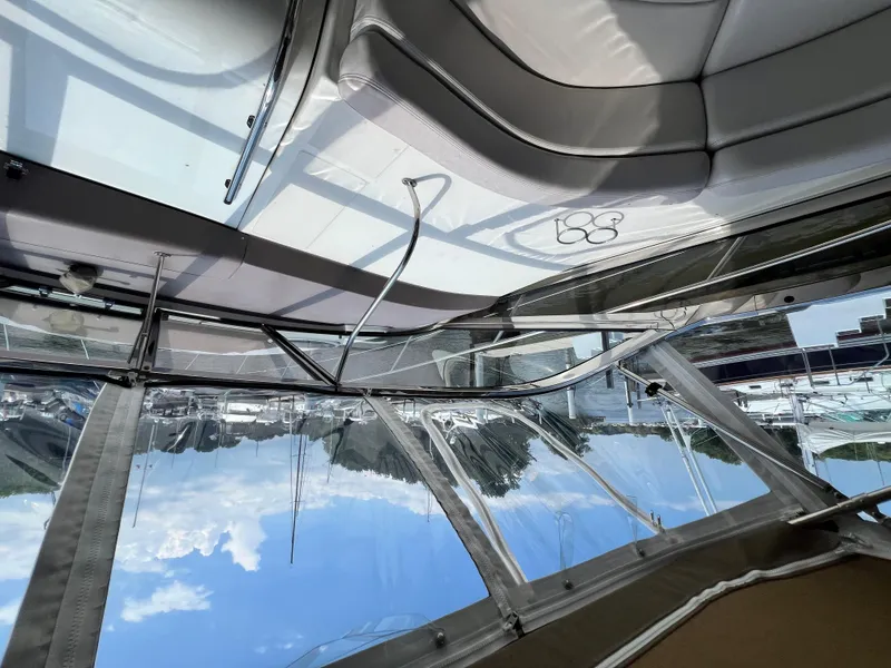 Slide: The Image of Interior view of 2002 Regal Commodore 4260 yacht with sleek seating and clear windows. - 45