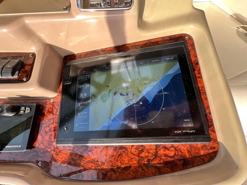 Slide: The Image of Navigation system on 2002 Regal Commodore 4260 boat dashboard, featuring GPS display. - 46